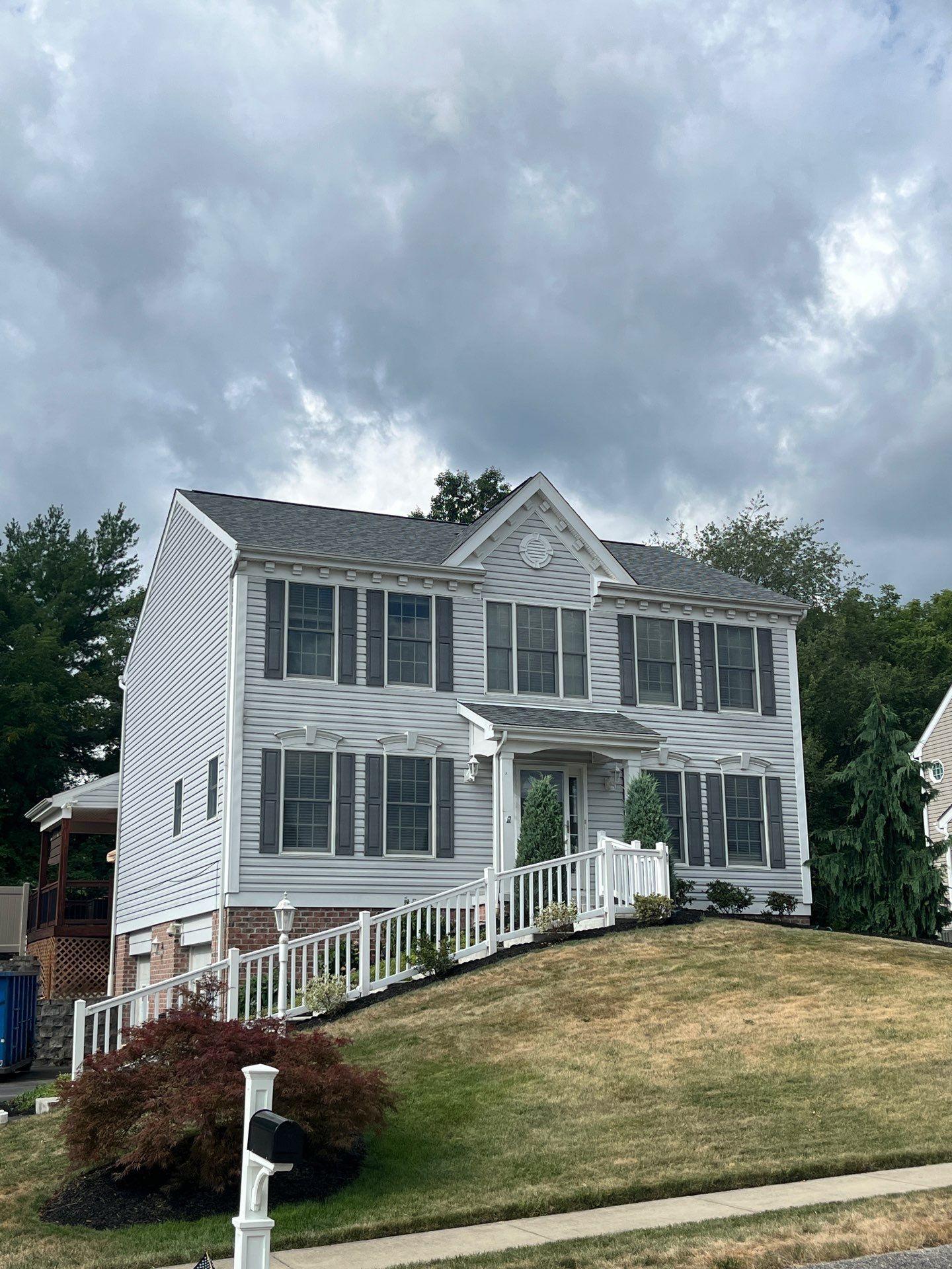 gray house with new roof