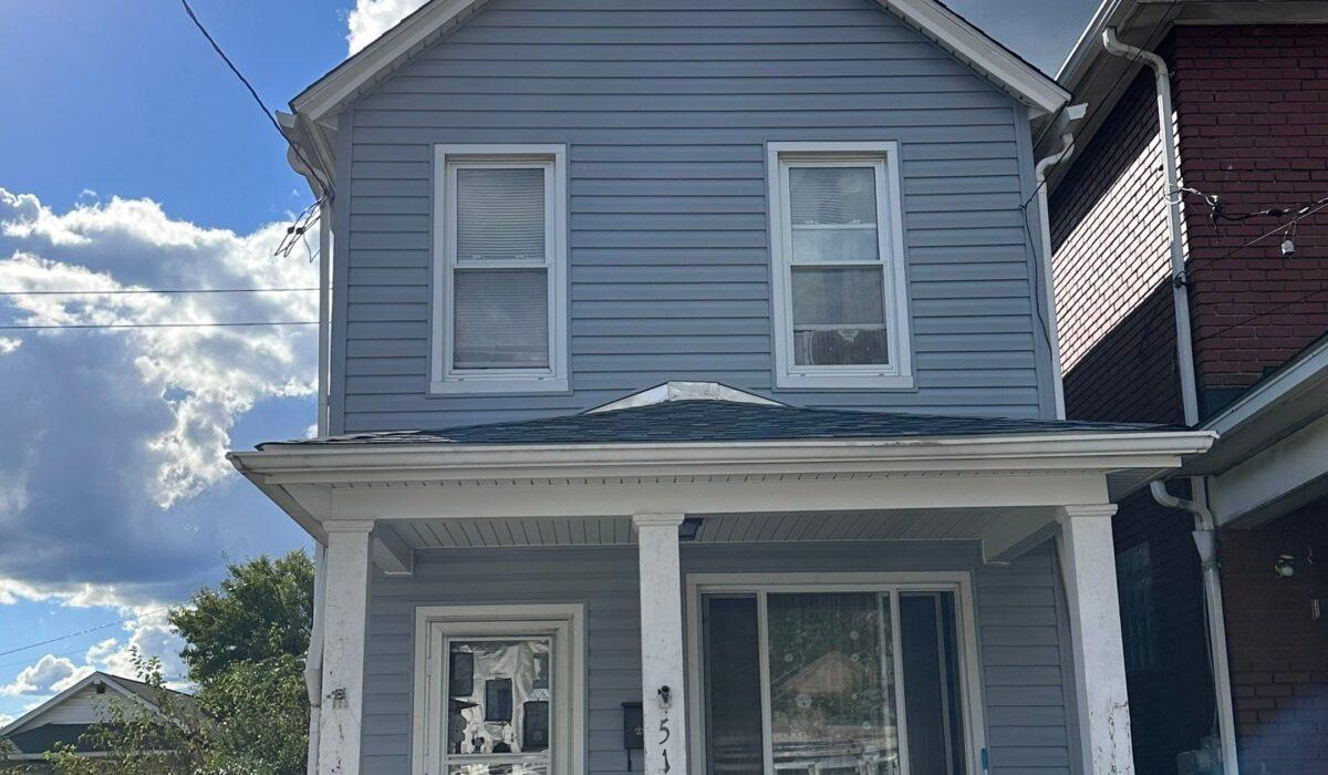 shotgun house with new roof and siding