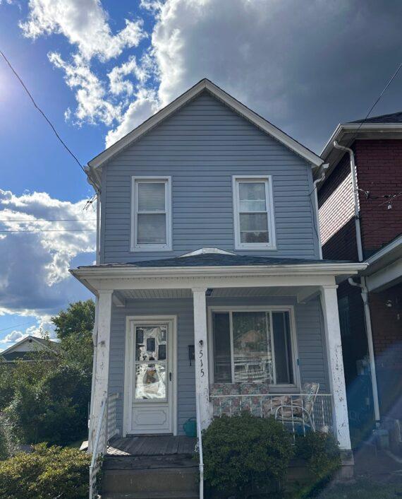 shotgun house with new roof and siding