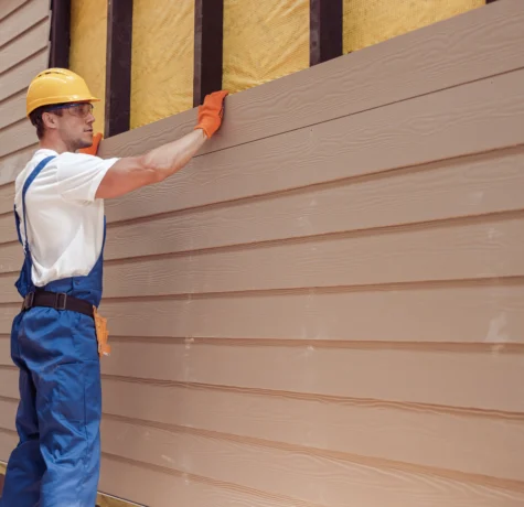 man installing siding