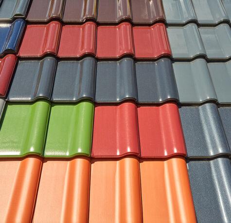 A roof is covered with different colored roof tiles.